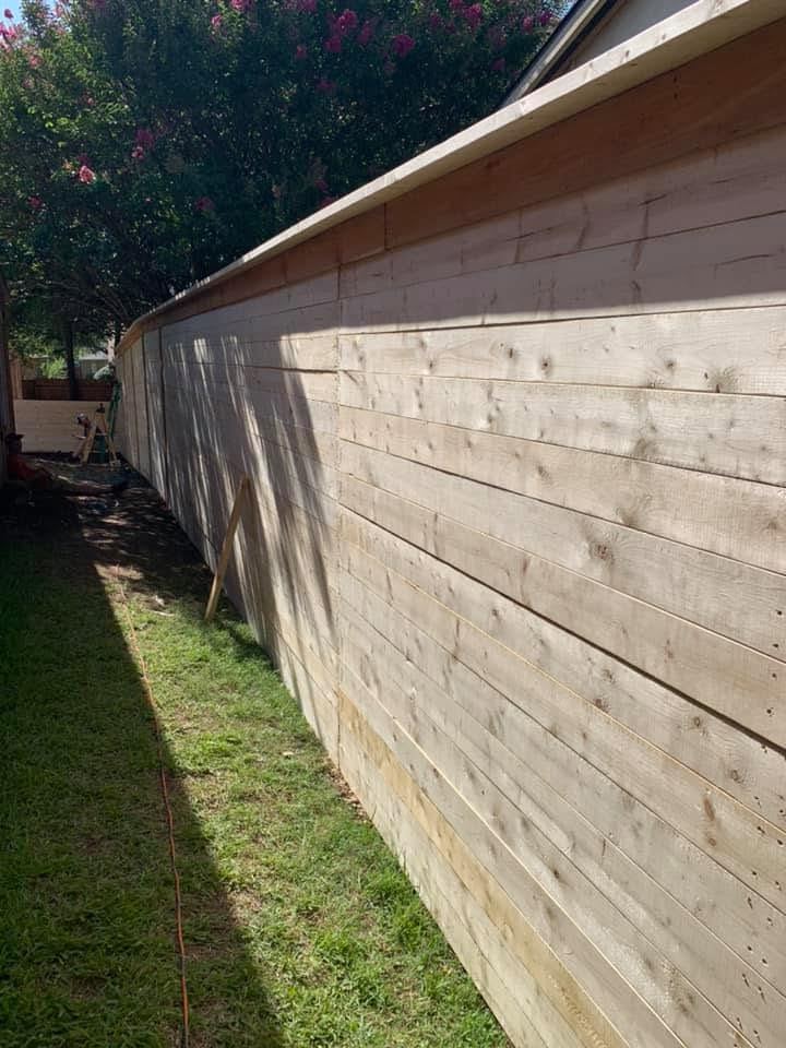 Long horizontal-plank wood fence line